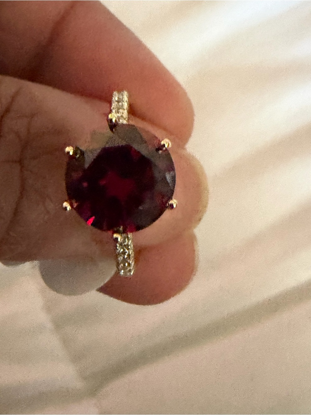 Gold Ring with Deep Burgundy Round Stone and Pavé Band